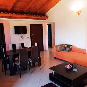 a living room with a couch and a table at Apartments Polonia Saranda in Sarandë