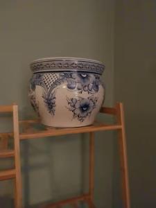 a blue and white vase sitting on a shelf at 40 Hirst Grove in Hebden Bridge