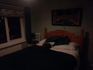 a bedroom with a bed and a window at 40 Hirst Grove in Hebden Bridge