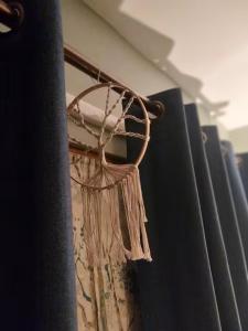 a curtain is hanging on a curtain rod at 40 Hirst Grove in Hebden Bridge