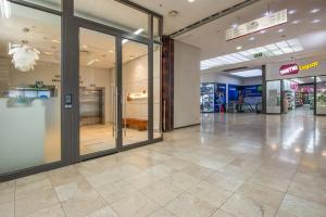 an empty lobby of a store with glass doors at Instellies Andringa Walk Apartment in Stellenbosch