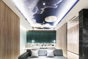a bedroom with a mural of the moon on the ceiling at Hotel The Moon -Adult Only- in Okayama +43 photos