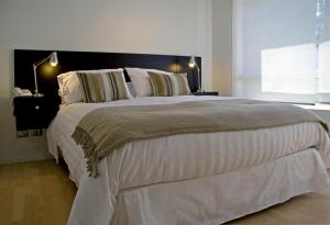 Katil atau katil-katil dalam bilik di Heidelberg Haus Apart Hotel