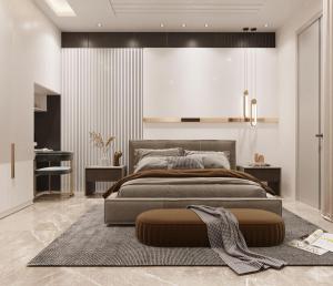 a bedroom with a large bed and a rug at Jugnu hotel in Rohtak