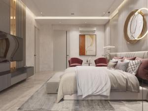 a bedroom with a large bed and red chairs at Jugnu hotel in Rohtak +6 photos