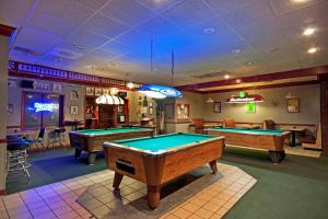 a billiard room with two pool tables in it at Rogers Inn in Rogers