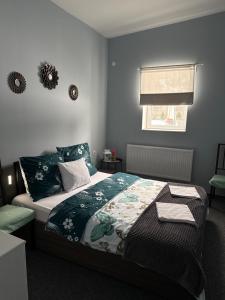 a bedroom with a bed and a window at Noclegi Adriana Kacperska in Tuszyn