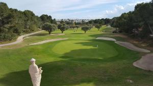 an aerial view of a green golf course at Royal Park Green Spa in Orihuela Costa