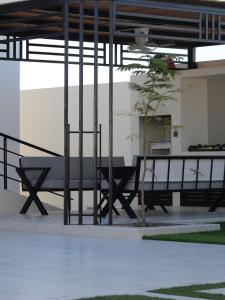 a group of benches and a table in a building at أستراحة بانا in Nizwa