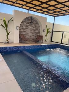 a swimming pool in the middle of a house with at أستراحة بانا in Nizwa