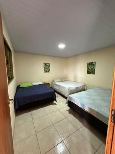 a room with two beds in a room at Rancho Corumba VI in Alexânia