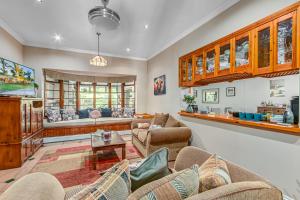 a living room with a couch and a table at Caledon 23 Guest House in George