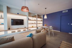 a living room with a couch and a table at Casa Costa Sud in Bari