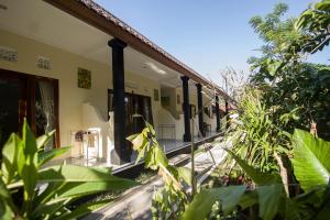 a building with plants in front of it at Pangkung Sari in Ubud