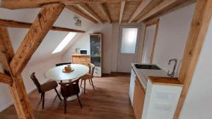 a kitchen and dining room with a table and chairs at Large Private Room Near Colmar Center with Free Public Parking in Colmar