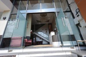 a view from the inside of a house with a glass wall at Hotel Amar Singh Palace in Agra