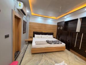 a bedroom with a large bed in a room at Govindam Palace in Govardhan