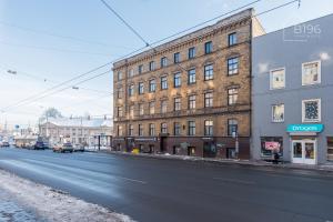 a large brick building on the side of a street at ApartHotel Riga Self Registration & Check-in in Riga