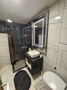 a bathroom with a sink and a shower at Stan na dan in Pljevlja