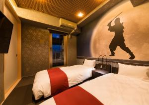 Postel nebo postele na pokoji v ubytování SARASA HOTEL Namba