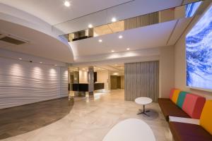 an office lobby with a large window at SARASA HOTEL Namba in Osaka +31 photos