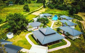 an overhead view of a row of houses with blue roofs at Nature Luxe Sigiriya in Sigiriya