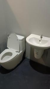 a bathroom with a toilet and a sink at แพนด้าแคมปิ้งเขาใหญ่ in Ban Khanong Phra Klang (1) +105 photos