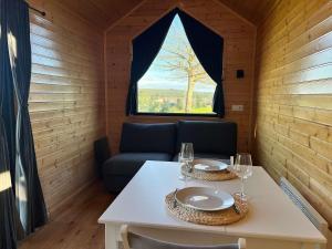 a dining room with a table and a window at Quinta da Runa by Tiny Away in Bagunte