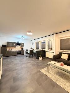 a living room with a couch and a table at KM Apparts 2 Wesel in Wesel