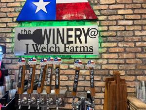 a sign on a brick wall with a bunch of baseball bats at Starry Skies RV in Victoria +13 photos