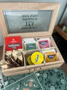 a wooden box filled with different types of candy at Clontrain Cottage in Carrickmacross