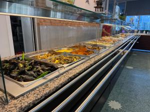 a buffet line with many different types of food at Hotel Cosmos in Eforie Sud +84 photos