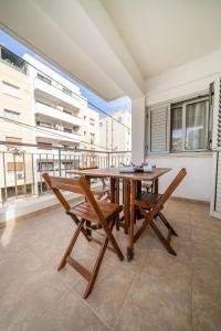 a dining room with a table and chairs and a balcony at 2 bedroom flat in Strovolos +15 photos
