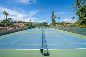 a tennis court with two benches on it at Kamaole Sands 1101 · KAS 1101 Updated Beachy Chic 2BD Across Bea in Wailea