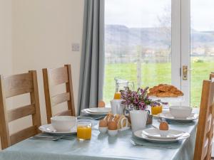 a table with a blue table cloth and eggs on it at Foxglove - Uk51200 in Staintondale +21 photos