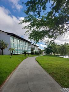 a walkway in front of a large building at Flat 207 Villa Hípica - Gravatá in Gravatá