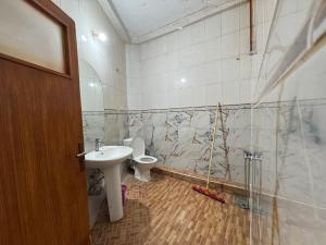 a bathroom with a toilet and a sink at Dar Bennis 2 in Rabat +21 photos