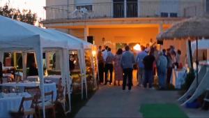 a group of people standing outside of a building at CASA MIGUEL y SALLY in Villanueva de las Manzanas