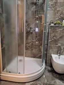 a shower stall in a bathroom with a sink at Val in Kaštela +29 photos