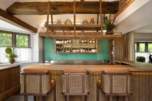 a large bar with wicker chairs in a restaurant at Hurley House Hotel in Hurley