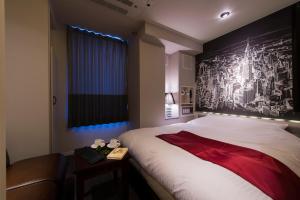 Postel nebo postele na pokoji v ubytování The CALM Hotel Tokyo