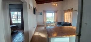 a living room with a table and a couch at Santa Relax in Frente Mar