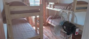 a couple of bunk beds in a room at Santa Relax in Frente Mar
