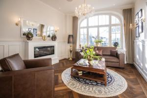 a living room with a couch and a coffee table at Hotel Alex an der Ahr in Bad Neuenahr-Ahrweiler