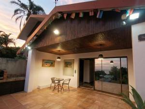 a patio with chairs and a table on a house at Da Vinci - Zur See in Ballito