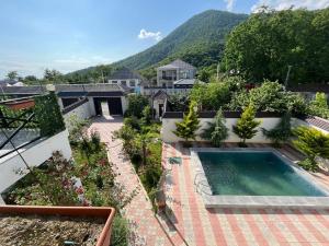 an aerial view of a house with a swimming pool at Qafqaz mountain villa in Mekhrably