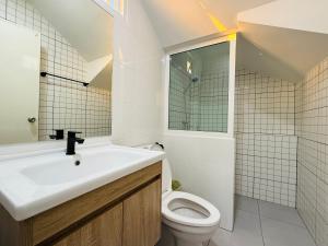 a white bathroom with a sink and a toilet at House in HangDong in Hang Dong +7 photos