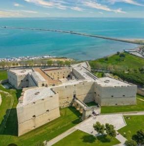 an aerial view of a large building next to the water at Panta Rei 97 in Barletta