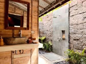 a bathroom with a sink and a shower at Green Space Ubud in Ubud +55 photos