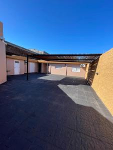 a large empty parking lot in a building at Fully equipped studio apartments in Apóstoles